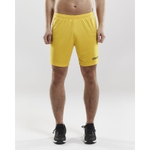 Craft Sporthose (Short) Squad Solid - ohne Innenshort, elastisches Material - gelb Herren