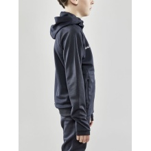 Craft Trainingsjacke Evolve Hood - strapazierfähige Mid-Layer-Kapuzenjacke aus Stretchmaterial - asphaltgrau Kinder