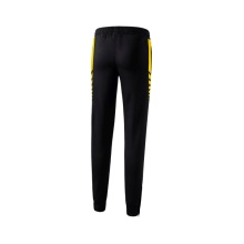 Erima Traingshose Six Wings Worker lang (100% Polyester, sportliche Passform) schwarz/gelb Damen